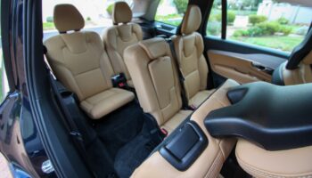 Interior view of 3-row family SUV model showing spacious second and third row passenger seating